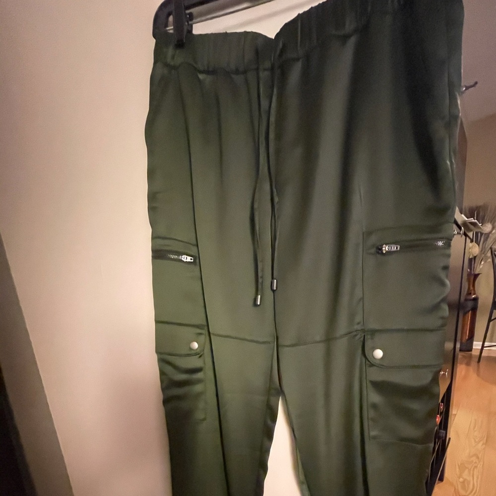 Green satin-finish pants banded ankles